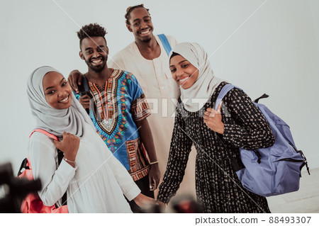 Group of happy african students having conversation and team meeting working together on homework girls wearing traidiional sudan muslim hijab fashion 88493307