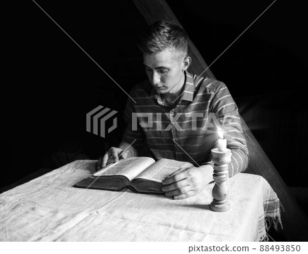 Young man reeding the book Young man reeding the book 88493850