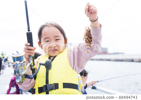 Girl enjoying fishing 88494741