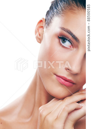 Reflecting on beauty. Studio shot of a beautiful young woman isolated on white. 88500585