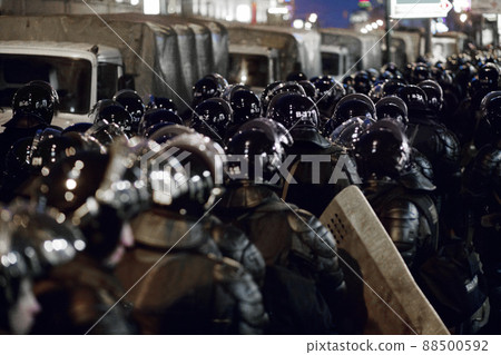 Let's create love not war. The army barricading a riot in the city. 88500592