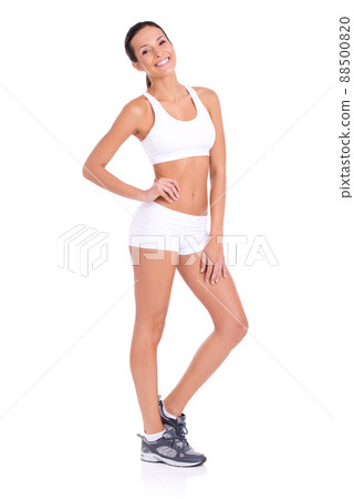 Confidence through fitness. Studio portrait of a fit young woman in exercise gear isolated on white. 88500820