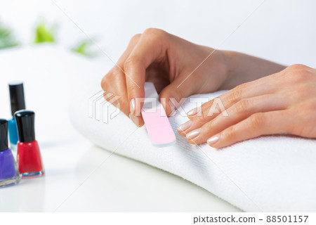Woman using nail file and create nails shape Woman using nail file and create nails shape 88501157