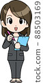 A business woman taking notes with a binder and a pen 88503169