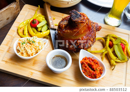 Popular dish of Austrian cuisine is roasted pork knuckle in beer sauce 88503512