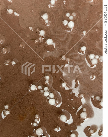 Hail that has fallen on terracotta tiles Hail that has fallen on terracotta tiles 88504111