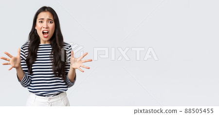 Lifestyle, people emotions and casual concept. Freak-out asian woman in panic, gesturing complaining and looking annoyed, Girl losing temper after touch day at work, having huge trouble 88505455