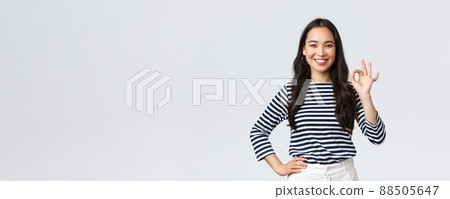 Lifestyle, beauty and fashion, people emotions concept. Satisfied good-looking female guarantee quality of product, recommend advertisement, showing okay sign, say no problem, all good Lifestyle, beauty and fashion, people emotions concept. Satisfied good-looking female guarantee quality of product, recommend advertisement, showing okay sign, say no problem, all good 88505647
