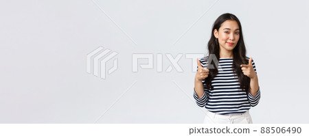Lifestyle, people emotions and casual concept. Well done, nice played. Pleased and impressed asian girl pointing fingers at camera to praise you, encourage or congratulate with great job 88506490