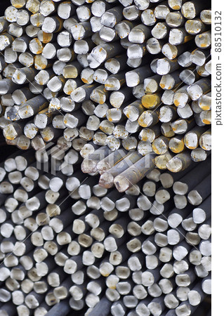 Metal profile of round section in packs at the warehouse of metal products Metal profile of round section in packs at the warehouse of metal products 88510132