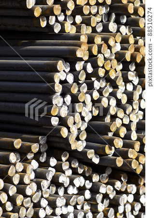 Metal profile of round section in packs at the warehouse of metal products Metal profile of round section in packs at the warehouse of metal products 88510274