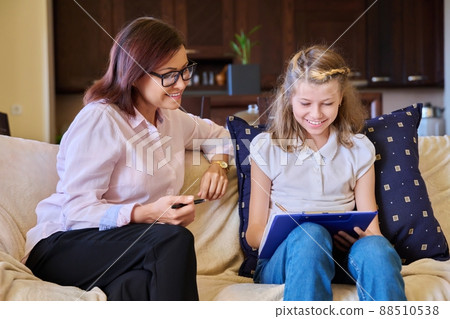Individual therapy session for child girl with psychologist. Individual therapy session for child girl with psychologist. 88510538