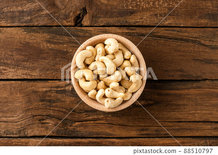 Fresh cashews in bowl on wooden table. Healthy snacks 88510797