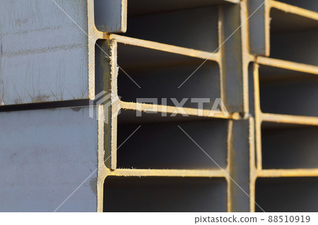 Metal profile beam in packs at the warehouse of metal products Metal profile beam in packs at the warehouse of metal products 88510919