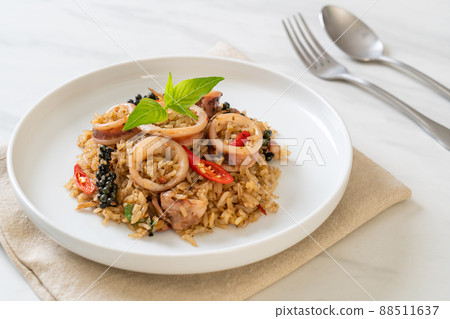 Basil and Spicy Herb Fried Rice with Squid or Octopus Basil and Spicy Herb Fried Rice with Squid or Octopus 88511637
