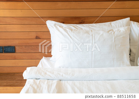 white pillow decoration on bed in bedroom 88511658