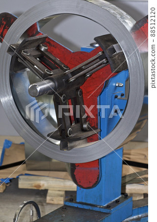Thin galvanized metal tape in a roll on the drum Thin galvanized metal tape in a roll on the drum 88512120