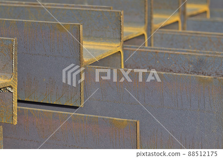Metal profile beam in packs at the warehouse of metal products Metal profile beam in packs at the warehouse of metal products 88512175