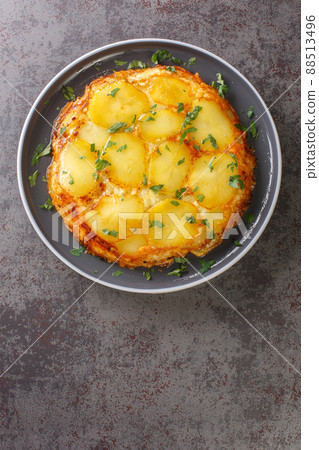 Pan haggerty is also known as potato bake or casserole it is a famous British dish from Northumberland closeup on the table. Vertical top view Pan haggerty is also known as potato bake or casserole it is a famous British dish from Northumberland closeup on the table. Vertical top view 88513496