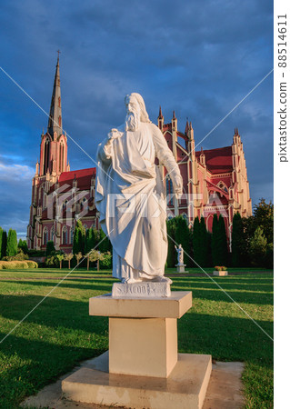 View of the Church of the Holy Trinity and the sculpture in front of it in Gervyaty, Grodno region, Belarus 88514611