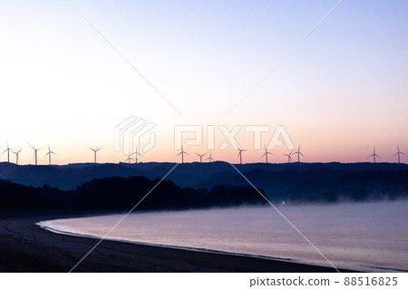 Windmills of wind farms and Yellow Magic Asahi spread innumerably in the eastern part of Shibushi Bay Windmills of wind farms and Yellow Magic Asahi spread innumerably in the eastern part of Shibushi Bay 88516825