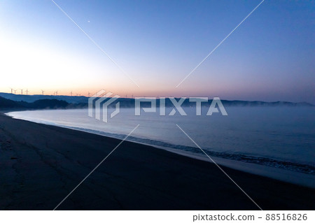 Windmills of wind farms and Yellow Magic Asahi spread innumerably in the eastern part of Shibushi Bay Windmills of wind farms and Yellow Magic Asahi spread innumerably in the eastern part of Shibushi Bay 88516826