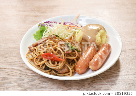 fried spicy spaghetti bacon with pork sausage and mashed potato dressing gravy sauce couple salad on plate fried spicy spaghetti bacon with pork sausage and mashed potato dressing gravy sauce couple salad on plate 88519335