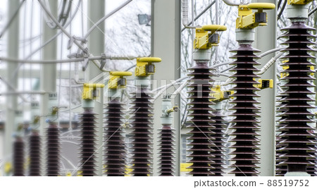 Insulators built in rows in an electric utility substation, selective focus. 88519752
