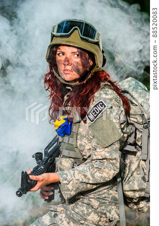 Ukranian female soldier in the forest 88520083