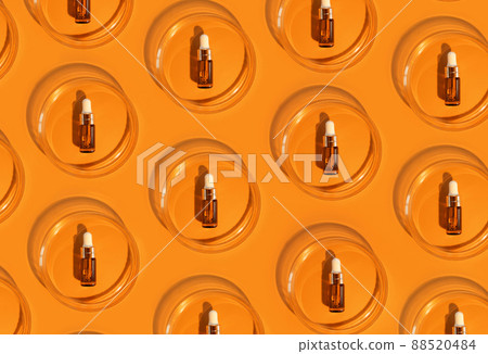 Amber bottle. Laboratory glass petri dish with pipette of water, serum, oil, beauty product. Natural medicine, cosmetic research, bio science. Pattern. Skincare and analysis concept. Dermatology Amber bottle. Laboratory glass petri dish with pipette of water, serum, oil, beauty product. Natural medicine, cosmetic research, bio science. Pattern. Skincare and analysis concept. Dermatology 88520484