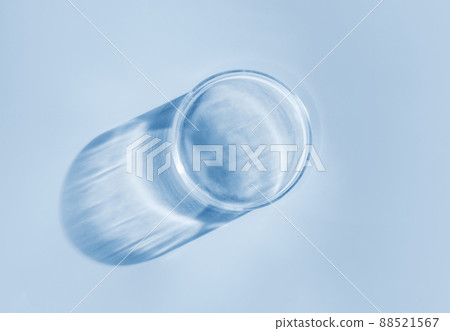 Empty laboratory glass petri for serum, oil, beauty products on orange background. Natural medicine, cosmetic research, bio science. Concept of skincare and analysis. Dermatology. Flat lay, top view Empty laboratory glass petri for serum, oil, beauty products on orange background. Natural medicine, cosmetic research, bio science. Concept of skincare and analysis. Dermatology. Flat lay, top view 88521567