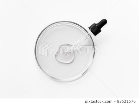 Laboratory glass petri with pipette and drop of water, serum, oil, beauty product. Natural medicine, cosmetic research, bio science. Concept of skincare and analysis. Dermatology. Flat lay, top view Laboratory glass petri with pipette and drop of water, serum, oil, beauty product. Natural medicine, cosmetic research, bio science. Concept of skincare and analysis. Dermatology. Flat lay, top view 88521576