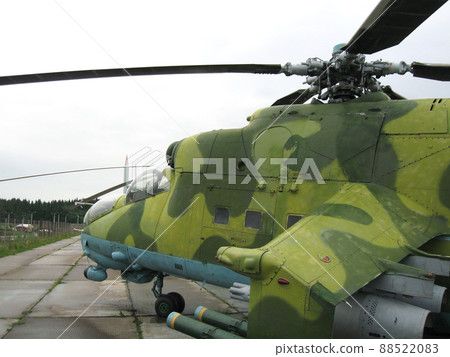 Parking green Military helicopter at a base. Combat vehicle 88522083