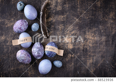Festive Easter eggs in purple and blue color 88523916