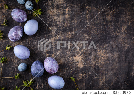 Festive Easter eggs in purple and blue color 88523920