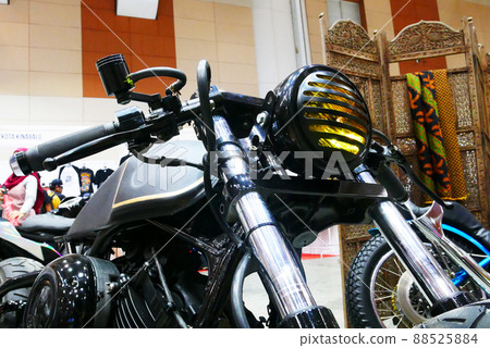 SELANGOR, MALAYSIA - 8 APRIL 2022: Branded motorcycle classic headlights installed on custom motorcycles. The motorcycle was displayed to the public in a large showroom. SELANGOR, MALAYSIA - 8 APRIL 2022: Branded motorcycle classic headlights installed on custom motorcycles. The motorcycle was displayed to the public in a large showroom. 88525884