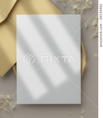 Blank greeting card invitation Mockup 5x7 on envelope with dry flowers and ribbon on paper background, flat lay, mockup Blank greeting card invitation Mockup 5x7 on envelope with dry flowers and ribbon on paper background, flat lay, mockup 88530482