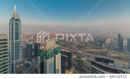 Panorama of Dubai Marina with JLT skyscrapers and golf course timelapse, Dubai, United Arab Emirates. Panorama of Dubai Marina with JLT skyscrapers and golf course timelapse, Dubai, United Arab Emirates. 88530552