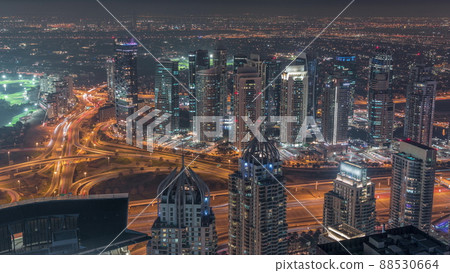 JLT and Dubai marina skyscrapers near Sheikh Zayed Road aerial night timelapse. Residential buildings 88530664