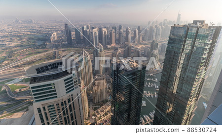 Panorama of Dubai Marina with JLT skyscrapers and golf course timelapse, Dubai, United Arab Emirates. 88530724