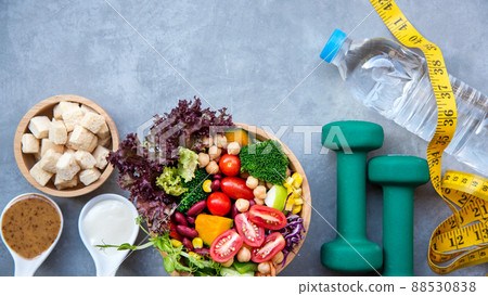 Diet and Healthy life loss weight exercise Concept. Fresh vegetable salad with Weight scale measure prevention for women diet slimming Diet and Healthy life loss weight exercise Concept. Fresh vegetable salad with Weight scale measure prevention for women diet slimming 88530838