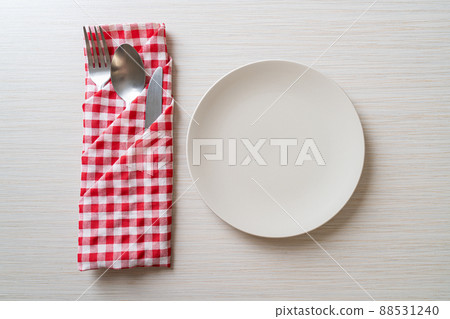 empty plate or dish with knife, fork and spoon empty plate or dish with knife, fork and spoon 88531240