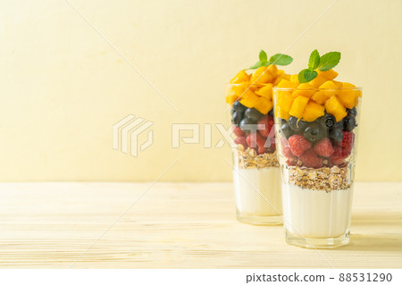 homemade mango, raspberry and blueberry with yogurt and granola 88531290