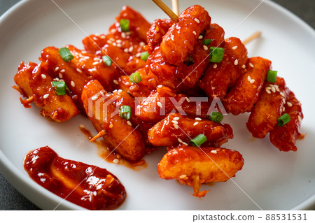 deep fried Korean rice cake (Tteokbokki) skewered with spicy sauce 88531531