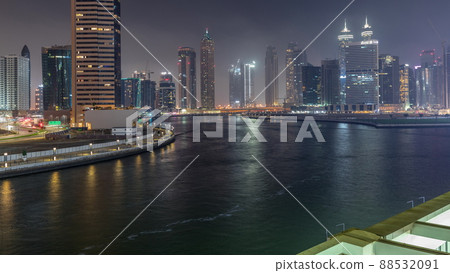 Modern city architecture in Business bay district. Panoramic view of Dubai's skyscrapers night timelapse Modern city architecture in Business bay district. Panoramic view of Dubai's skyscrapers night timelapse 88532091