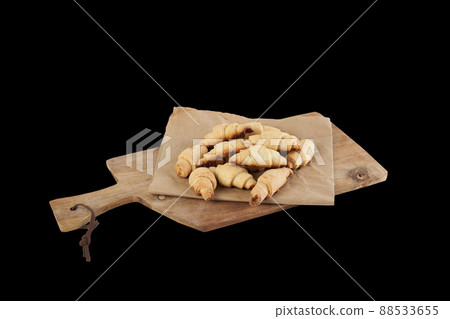 Isolated russian slavic traditional pastry called roguelikes. Cakes bagels. Crispy croissants. Food on black background 88533655