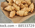 Russian slavic traditional pastry called roguelikes. Cakes bagels. Crispy croissants. Food on grey background, Closeup view 88533729