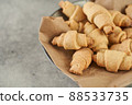 Russian slavic traditional pastry called roguelikes. Cakes bagels. Crispy croissants. Food on grey background, Copy space 88533735