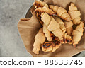 Russian slavic traditional pastry called roguelikes. Cakes bagels. Crispy croissants. Food on grey background, Copy space 88533745