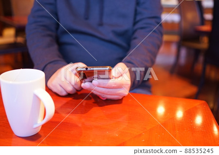 Man operating a smartphone 88535245
